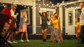 Parents, Children and Multicultural Friends Dancing Together at a Garden Party Disco Event at Home Royalty Free Stock Photo