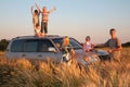 Parents and children on offroad car on wheaten fie Royalty Free Stock Photo