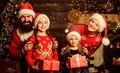 Parents and children opening christmas gifts. Christmas tradition. Boxing day. Happy holidays. Father bearded man and Royalty Free Stock Photo