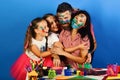 Parents and children painted with gouache. Family leisure time Royalty Free Stock Photo