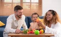 Parents and children relax in the living room of the house. Royalty Free Stock Photo