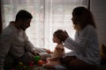 Parents and children relax in the living room of the house. Royalty Free Stock Photo