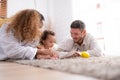 Parents and children relax in the living room of the house. Royalty Free Stock Photo