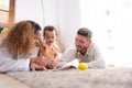 Parents and children relax in the living room of the house. Royalty Free Stock Photo