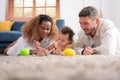 Parents and children relax in the living room of the house Royalty Free Stock Photo