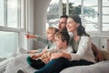 Parents, children and relax by window, happy and pointing with view, bonding and love with in family house. Father Royalty Free Stock Photo