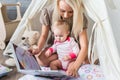 Parents with children in a teepee