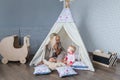 Parents with children in a teepee