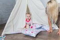 Parents with children in a teepee