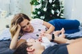 Parents cuddling baby in bed at home. Mom, dad and baby. Happy family concept. Royalty Free Stock Photo