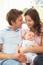 Parents Cuddling Newborn Baby Boy At Home Royalty Free Stock Photo