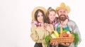 Parents and daughter celebrate harvest. Harvest festival concept. Family farmers gardeners vegetables harvest isolated