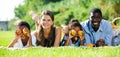 Parents with daughter and son lying on grass Royalty Free Stock Photo