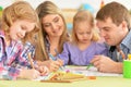 Parents with daughters drawing with pencils Royalty Free Stock Photo