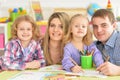 Parents with daughters drawing with pencils Royalty Free Stock Photo