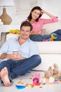 Parents enjoying a rest at home Royalty Free Stock Photo