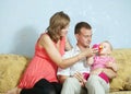 Parents feeding her baby with bottle Royalty Free Stock Photo