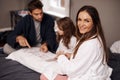 Parents, girl and game of cards for portrait in home with bonding, learning and happy for strategy in bedroom. Dad Royalty Free Stock Photo