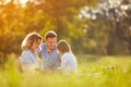 Parents with girl in green park Royalty Free Stock Photo