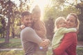 Parents give a hug daughters. Happy smiling family.