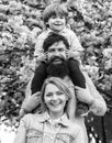 Parents giving piggyback ride to child. Happy family outdoors. Mother father and son. Portrait of family fun outside Royalty Free Stock Photo