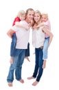Parents giving their children piggyback ride Royalty Free Stock Photo