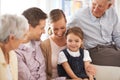 Parents, grandparents or child with portrait on sofa for healthy development, security or comfort in apartment. Family Royalty Free Stock Photo