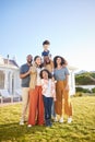 Parents, grandparents and children outdoor portrait at house laughing together on funny vacation in summer. Interracial Royalty Free Stock Photo