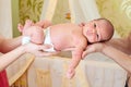 Parents' hands holding newborn baby boy Royalty Free Stock Photo