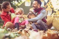 Parents have playing with children. Autumn season. Royalty Free Stock Photo