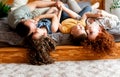 Parents having fun with their two little kids on bed. Royalty Free Stock Photo