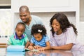 Parents helping children doing homework Royalty Free Stock Photo