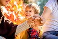 Parents hold the baby hands. Closeup of baby hand into parents hands. Concept of unity, support, protection, happiness Royalty Free Stock Photo