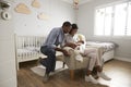 Parents Home from Hospital With Newborn Baby In Nursery Royalty Free Stock Photo