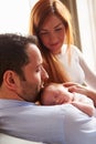 Parents At Home With Sleeping Newborn Baby Daughter Royalty Free Stock Photo