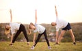 Parents instill sports habits in their child by example, focus on child. Happy sporty family doing stretching exercises