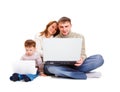 Parents and kid with laptop Royalty Free Stock Photo