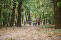 Parents and kids cycling on forest trail. Young family cycling in autumn park. Family mountain biking on forest. Theme family Royalty Free Stock Photo