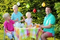 Parents with kids having lunch outdoors Royalty Free Stock Photo