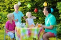 Parents with kids having lunch outdoors Royalty Free Stock Photo