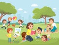 Parents with kids at the park. Mum reading book to children Royalty Free Stock Photo