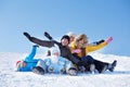 Parents and kids on snowy hill Royalty Free Stock Photo