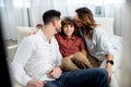 Parents kissing their son Royalty Free Stock Photo