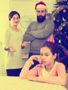 Parents lecturing daughter at Christmas Royalty Free Stock Photo