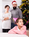 Parents lecturing daughter at Christmas Royalty Free Stock Photo