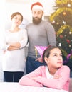 Parents lecturing daughter at Christmas Royalty Free Stock Photo