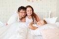 Parents look at little girl sleep in bed in bedroom with crown.Princess birthday Royalty Free Stock Photo