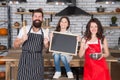 Parents mom dad and daughter chalkboard at kitchen, cook with love concept