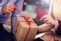 Parents opening Christmas gift pack Royalty Free Stock Photo