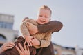 Parents play with their child close-up. Boy flying and laughing, happy family Royalty Free Stock Photo